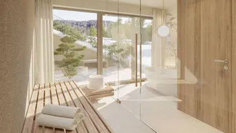 Modernes Badezimmer mit Sauna, freistehender Badewanne und großen Fenstern mit Waldblick.