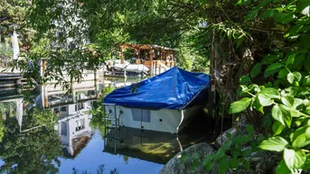 Expose Toller Baugrund mit Bootsanlegestelle und Ferienhäuschen am Ausgang des Ossiachersees