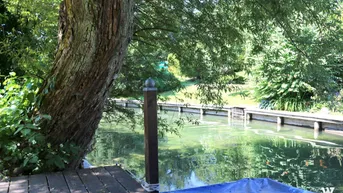 Expose Toller Baugrund mit Bootsanlegestelle und Ferienhäuschen am Ausgang des Ossiachersees