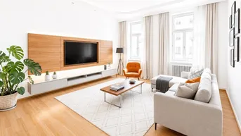 Helles Wohnzimmer mit modernem TV-Möbel, bequemer Couch und Holzboden, ideal zum Entspannen.