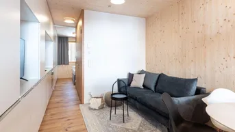 Expose Erstklassiges Wohnen auf 33 m²: Moderne 2-Zimmer Vollholz Wohnung mit Balkon, Stellplatz und Fußbodenheizung in Au!