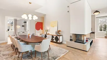 Eleganter Essbereich mit großem Holztisch, modernen Stühlen und integriertem Kamin.