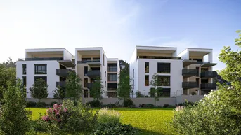 Moderne Wohngebäude mit weißer Fassade, Balkonen und Flachdächern in grüner Umgebung.