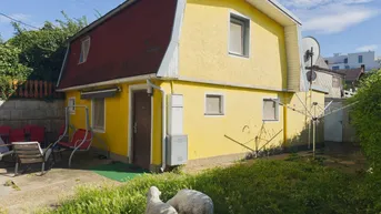Expose Charmantes Einfamilienhaus in idyllischer Kleingartensiedlung nahe U1 „Altes Landgut“