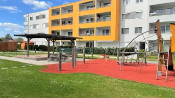 Expose Neuwertige 3-Zimmer Norikum-Wohnung mit einem gemütlichen Garten