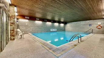 Expose Eigentumswohnung mit Loggia, Indoor-Pool, Sauna und Garage