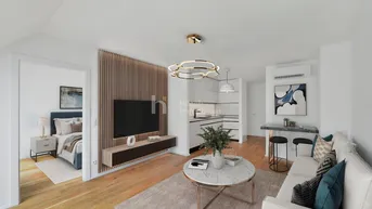 Modern inszenierter Wohnbereich mit offener Küche, Holzboden und Zugang zum Schlafzimmer.