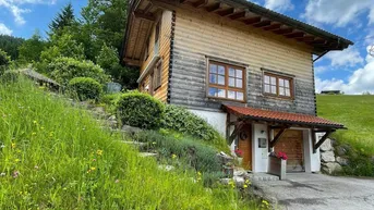 Expose Holzblockhaus an der Skipiste