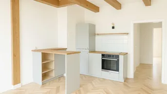 Expose Schmuckstück am Fuße des Schlossbergs: Wunderschön sanierte 2-Zimmer Dachgeschoss-Wohnung in zentraler Lage Graz!