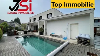 Expose Dieses neuwertige Einfamilienhaus mit beheizten Pool ist ein Blickfang.