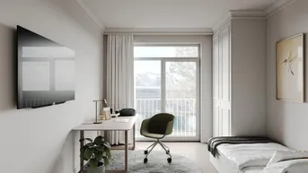 Helles Schlafzimmer mit Einzelbett, Schreibtisch und Zugang zu einem französischen Balkon.