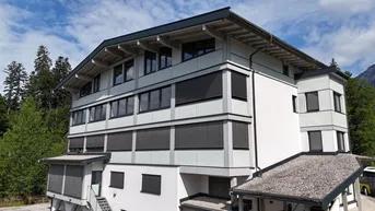 Expose Dachgeschosswohnung mit alpinem Charakter – Erstbezug
