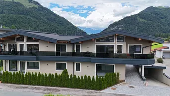 Expose Exklusives Wohnen in Ruhelage – Neubau mit nur vier Wohneinheiten in Kössen, Top 2 im Erdgeschoss