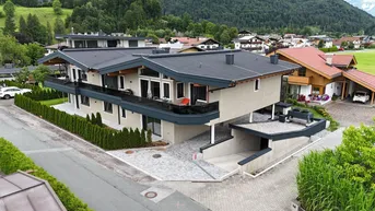 Expose Exklusives Wohnen in Ruhelage – Neubau mit nur vier Wohneinheiten in Kössen, Top 2 im Erdgeschoss