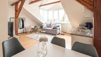 Expose Reizende 2-Zimmer-Dachgeschosswohnung mit Schlossbergblick