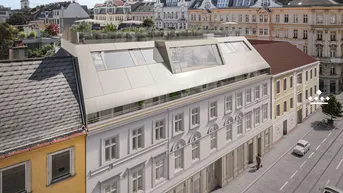 Luftaufnahme eines historischen Gebäudes mit modernem Dachausbau, Dachterrasse und Stadtblick.