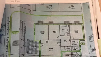 Detaillierter Grundriss der Erdgeschosswohnung mit Terrasse und Gartenanteil, inklusive Raumgrößen.