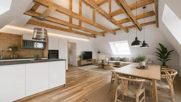 Offener Wohn-Essbereich mit moderner Küche, sichtbaren Holzbalken und viel Tageslicht durch Dachfenster.