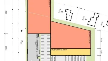 Übersichtsplan eines Gewerbeobjekts mit Produktions-, Lager- und Büroflächen sowie Anlieferzone und Parkplätzen.