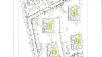 Übersichtsplan des Bauprojekts mit mehreren Gebäuden und der umliegenden Infrastruktur.
