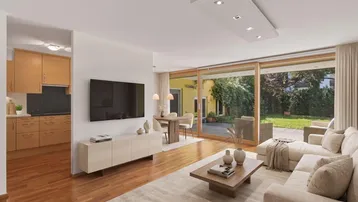 Helles, offenes Wohn- und Esszimmer mit Holzboden und Zugang zum Gartenbereich.