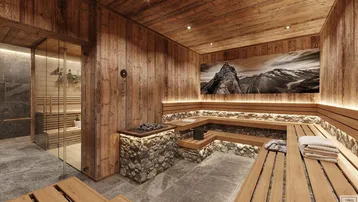 Geräumiger Wellnessbereich mit Holzverkleidung, Steinakzenten und integrierter Sauna für Entspannung.
