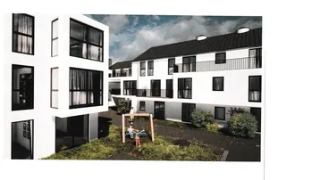 Moderne Wohnanlage mit begrüntem Innenhof und Kinderspielplatz.