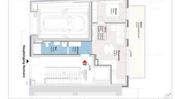 Grundrissplan einer Wohnung mit Wohnküche, Schlafzimmer, Bad und Balkon.