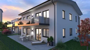 Moderne Wohnanlage mit Balkonen und Terrassen, umgeben von Grünflächen bei Sonnenuntergang.