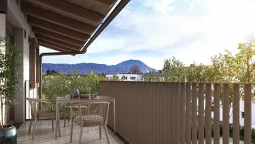 Gemütlicher Balkon mit Holzdach und Rattanmöbeln bietet einen weiten Blick auf die Berge.