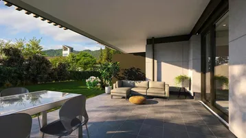 Geräumige Terrasse mit modernen Gartenmöbeln und Blick ins Grüne.