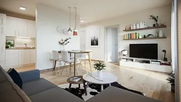 Heller offener Wohn- und Essbereich mit integrierter Küche und modernem Design.
