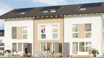 Moderne Reihenhäuser mit großen Fenstern, Balkonen und Photovoltaikanlagen auf den Dächern.