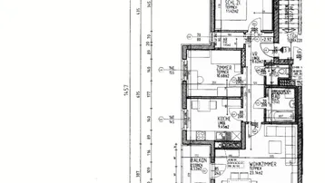 Detaillierter Grundriss einer Wohnung mit Balkon, zwei Schlafzimmern, Bad und separatem WC.