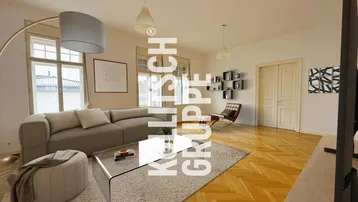 Helles Wohnzimmer mit modernem Sofa, Couchtisch und Fischgrätparkettboden, virtuell inszeniert.