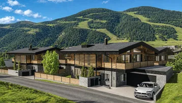 Moderne Chalet-Architektur mit Holzfassade und Bergblick in alpiner Umgebung.