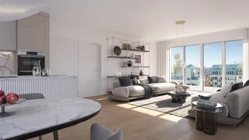 Heller, offener Wohnbereich mit integrierter Küche, Essbereich und Zugang zum Balkon.