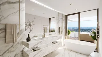 Luxuriöses Badezimmer mit Marmorverkleidung, freistehender Badewanne und Zugang zur Terrasse mit Stadtblick.
