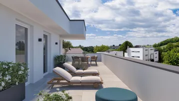 Geräumige Dachterrasse mit modernen Lounge-Möbeln und weitem Blick über die grüne Landschaft.