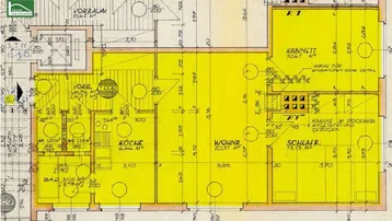 Detaillierter Grundrissplan einer Wohnung mit Küche, Bad, separatem WC und Kamin.