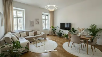 Helles Wohn- und Esszimmer mit Fischgrätparkett, beigem Sofa und modernem Esstisch.