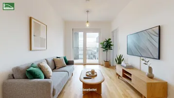 Helles Wohnzimmer mit modernem Sofa, Holzboden und Zugang zu einem Balkon.