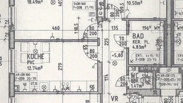 Grundriss einer Wohnung mit Wohnzimmer, zwei Zimmern, Küche, Bad, separatem WC, Abstellraum und Balkon.