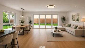 Helles, offenes Wohn- und Esszimmer mit Holzboden und Zugang zum Gartenbereich.
