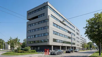 Modernes Mehrfamilienhaus mit klarer Architektur, großen Fenstern und Loggien in städtischer Umgebung.