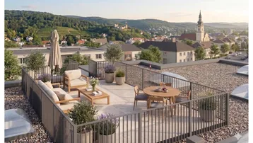 Große Dachterrasse mit Sitzgelegenheiten und weitem Blick über die Stadt und umliegende Landschaft.