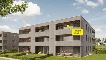 Moderne Wohngebäude mit Holzfassade, Balkonen und begrünten Außenbereichen in sonniger Umgebung.