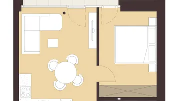 Grundriss einer Wohnung mit offenem Wohnbereich, integrierter Küche, Schlafzimmer und großem Balkon.
