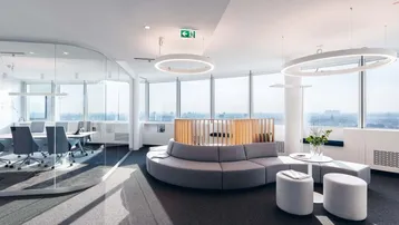 Moderner Bürobereich mit Glaswänden, runden Sitzgelegenheiten und weitem Stadtblick durch große Fenster.