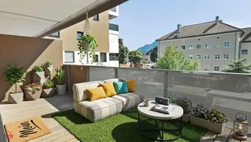 Gemütlicher Balkon mit Kunstrasen, Sitzgelegenheiten und Bergblick, ideal zum Entspannen im Freien.